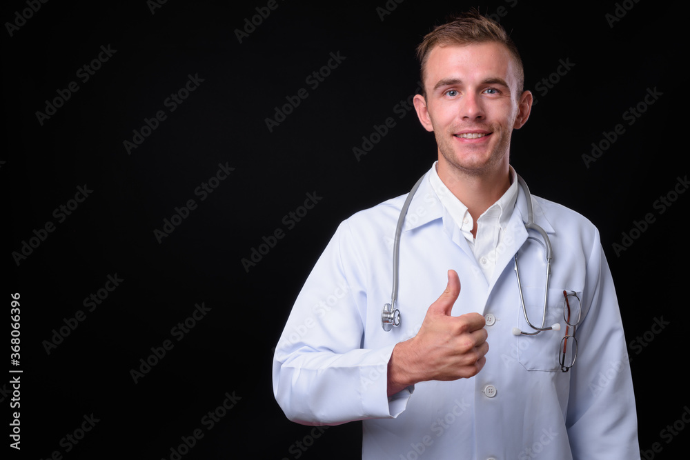 Portrait of young handsome man doctor with blond hair Portrait of young handsome man doctor with blond hair
