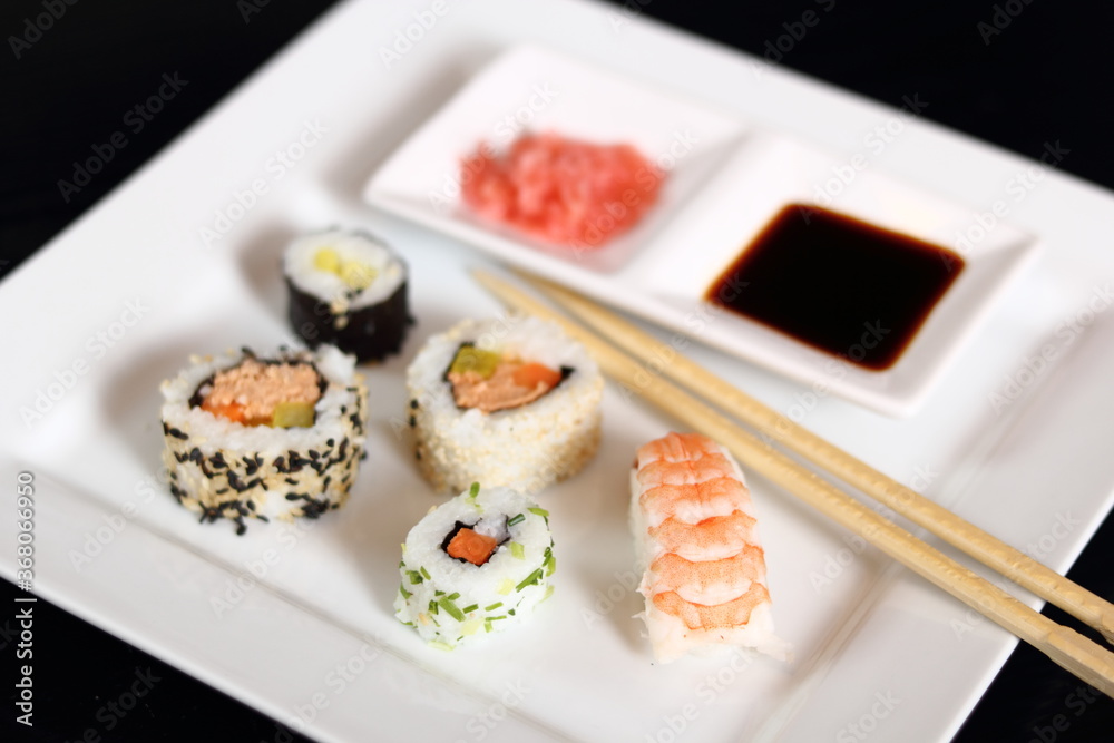 Sushi set with gari and soy sauce on plate Sushi set with gari and soy sauce on plate