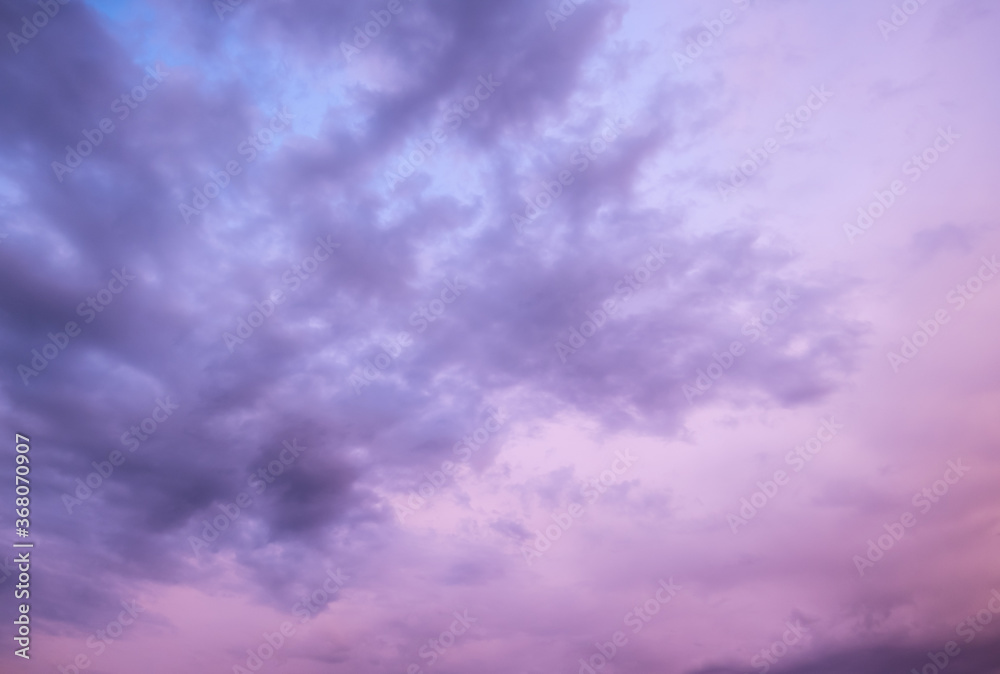 Beautiful evening pink sky with clouds during sunset dusk hours. cloudscape background pattern