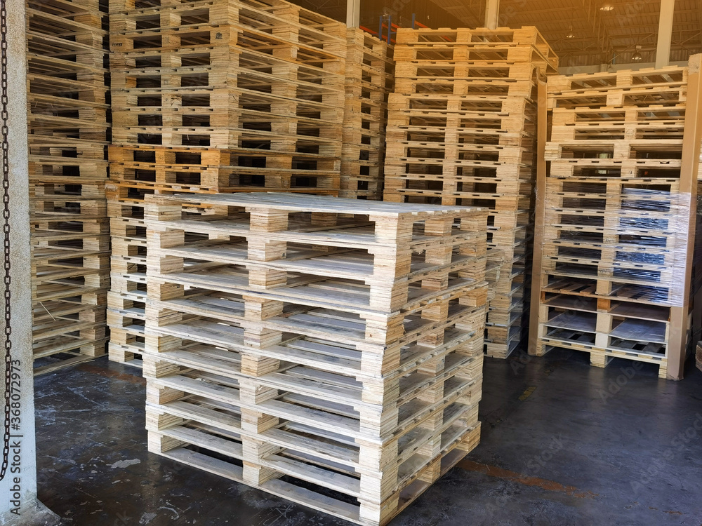 Wooden pallets stack at the freight cargo warehouse for transportation and logistics industrial Wooden pallets stack at the freight cargo warehouse for transportation and logistics industrial