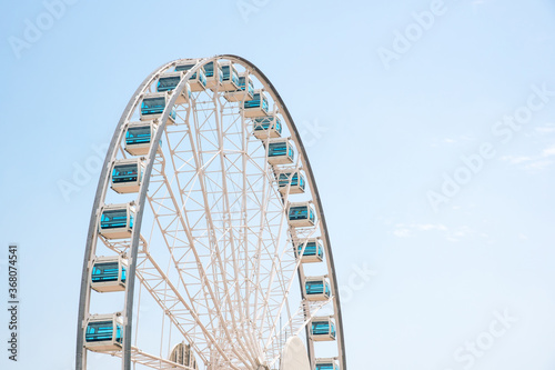 Close up Giant Ferris Wheel in Hong Kong near Victoria Harbor with clear sky background,Hong Kong