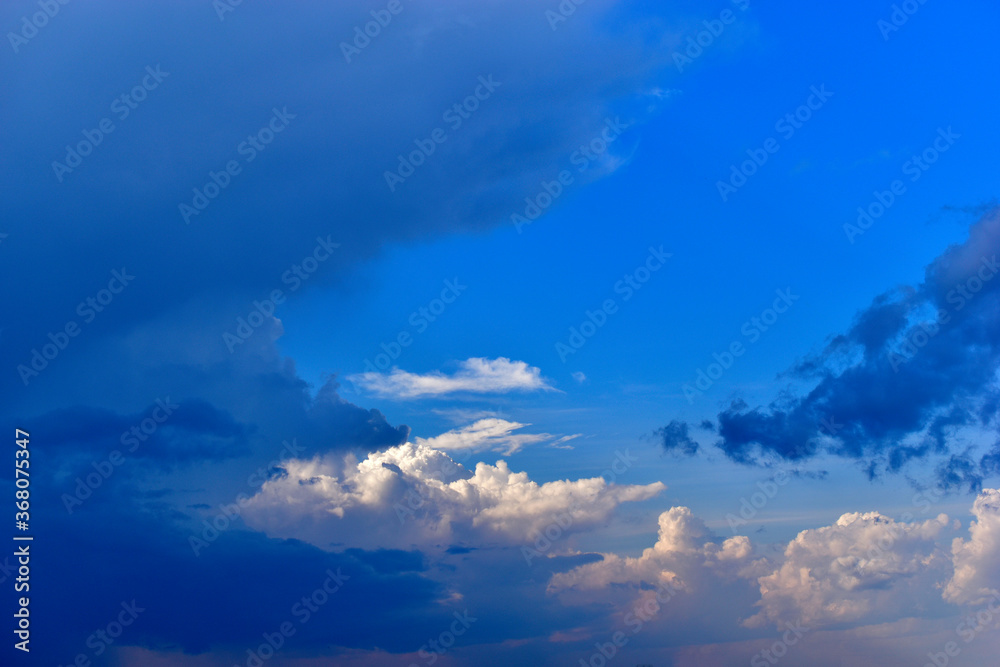 The stormy beauty of the blue Cumulus clouds in summer
