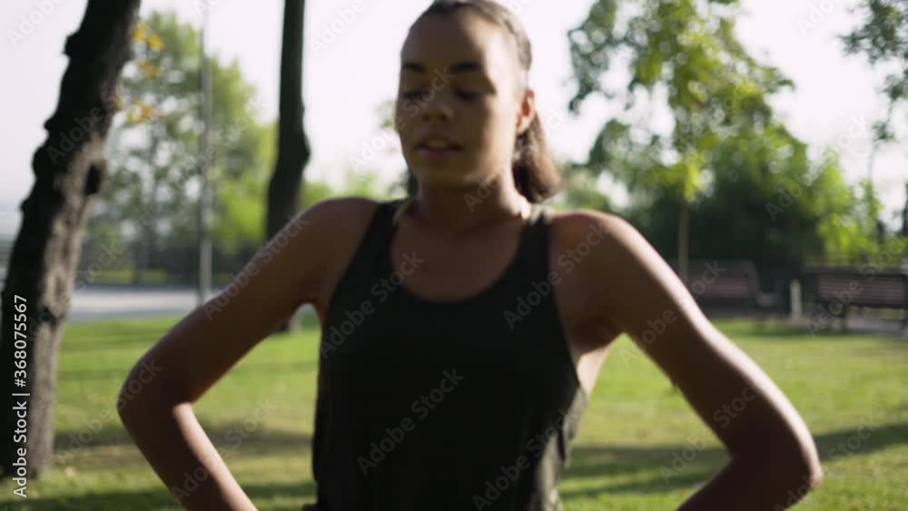 girl runner resting in the park after jogging. 4K girl runner resting in the park after jogging. 4K