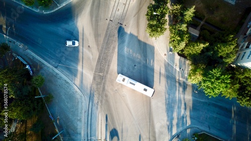 Aerial view of the crosswalk and road junction at the sunset. 