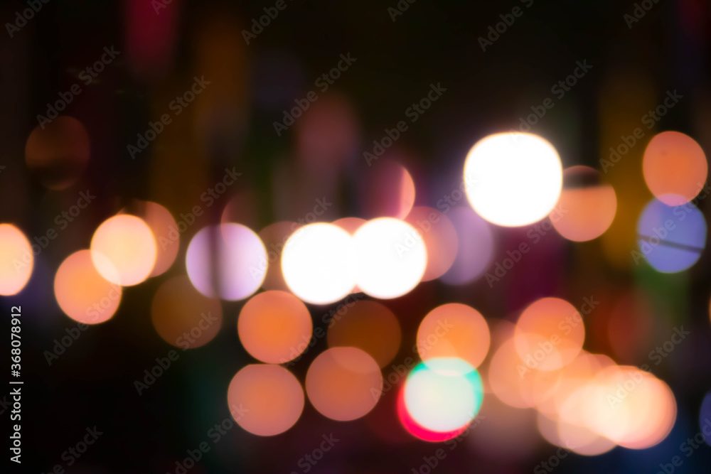 Blur the lights on the restaurant. Blurred cafe background with bokeh. orange ,red, light, blue, green, pink. Blur the lights on the restaurant. Blurred cafe background with bokeh. orange ,red, light, blue, green, pink.