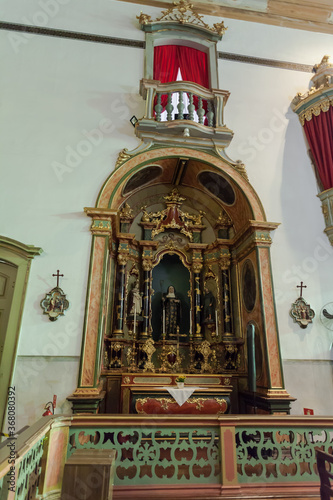  ancient church wide-angle view inside with local saints of faith and christian worship golden green and red details