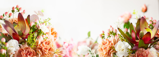 Autumn composition made of beautiful flowers on light backdrop. Floristic decoration. Natural floral background.