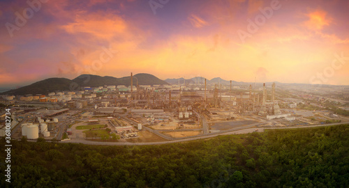 Ariel panorama view of oil and gas refinery plant of petroleum or petrochemical industry production with sunrise sky environment