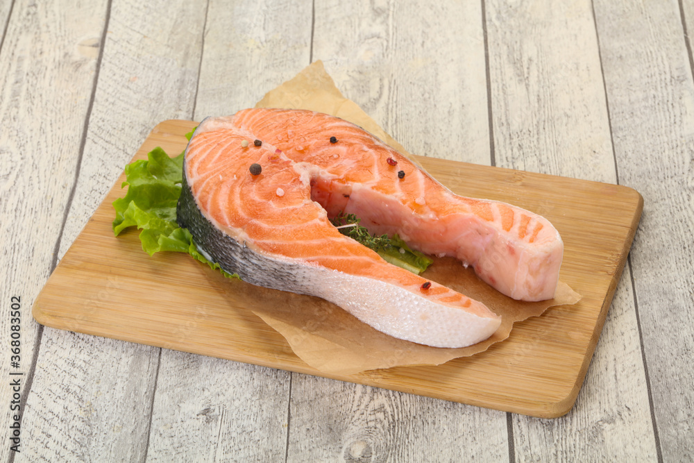 Raw salmon steak - ready for grill Raw salmon steak - ready for grill