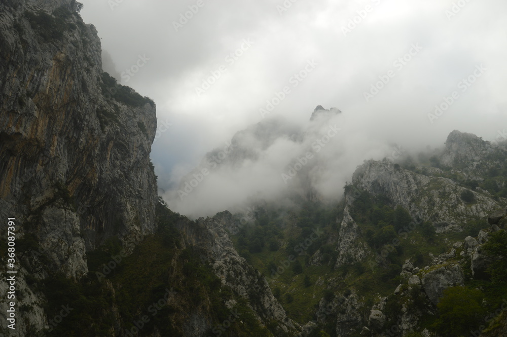The dramatic landscape of the Picos de Europa mountains in Cantabria and Castile and León in Spain The dramatic landscape of the Picos de Europa mountains in Cantabria and Castile and León in Spain