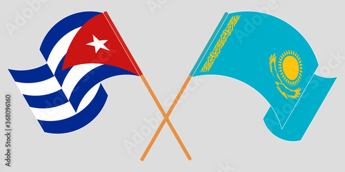 Crossed and waving flags of Cuba and Kazakhstan