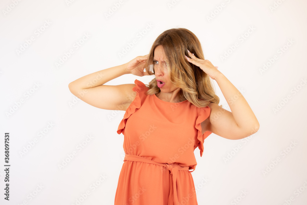 Beautiful woman in orange dress on white background Beautiful woman in orange dress on white background