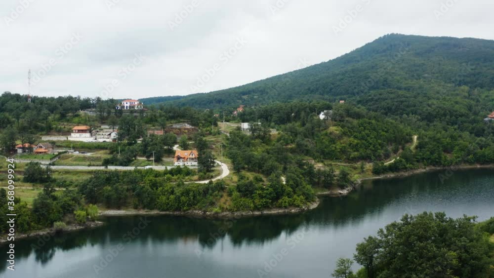 flight with a drone over a mountain lake with a scenic horizon and forests on the edge of the mountains flight with a drone over a mountain lake with a scenic horizon and forests on the edge of the mountains