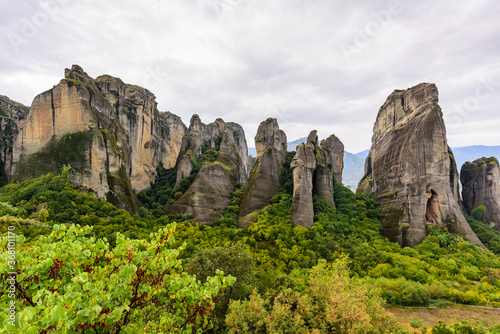View of the stunning rock formations of Meteora and Holy Monastery of Varlaam. 
