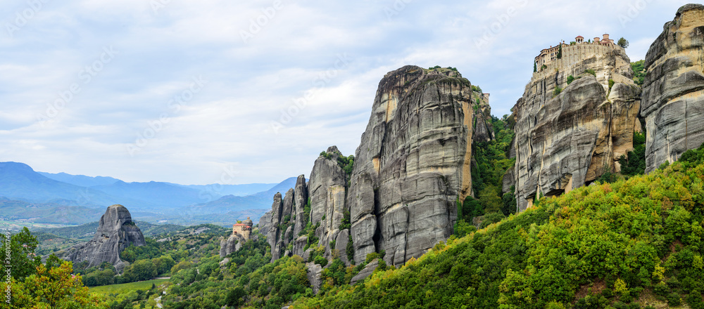 Wide panoramic view of the mountain formations of Meteora, Monastery of Varlaam on the right and Holy Monastery of Saint Nicholas Anapafsas at Meteora on the left