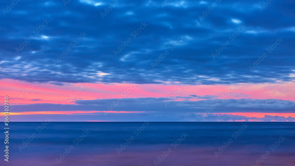 Atlantic ocean and sky with clouds after sunset