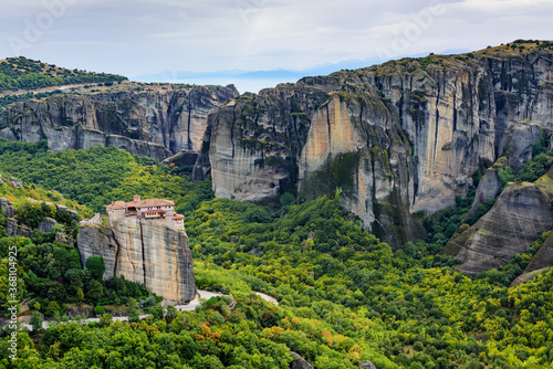 View of the stunning rock formations of Meteora and Holy Monastery of Rousanou. TheMonastery has received the name of the first probable hermit who settled on the rock. 