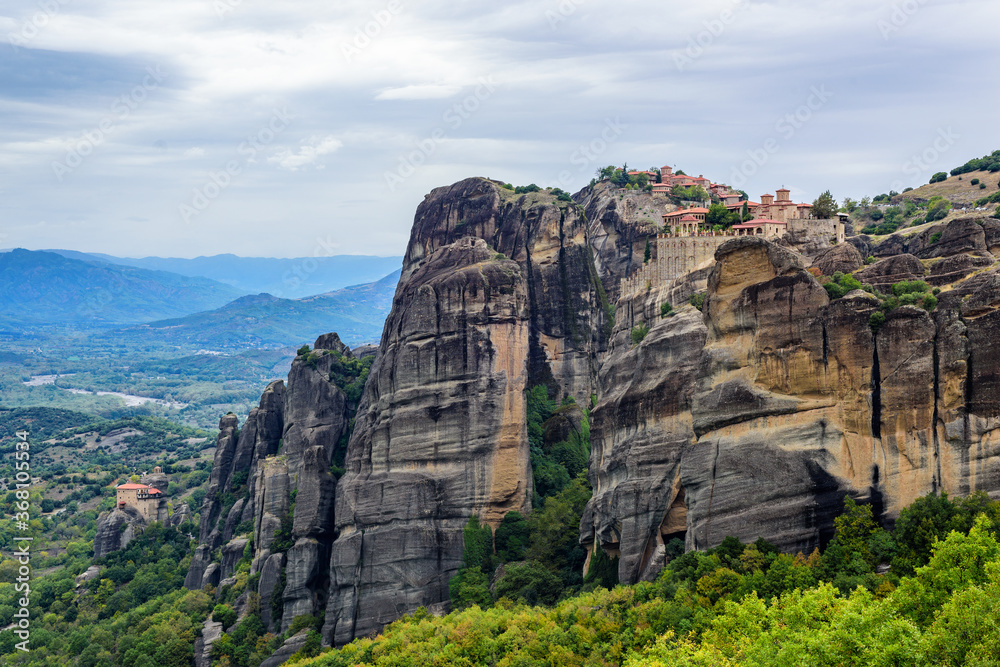 View of the stunning rock formations of Meteora and Holy Monastery of the Transfiguration of Christ, Monastery of Varlaam and Holy Monastery of Saint Nicholas Anapafsas at Meteora