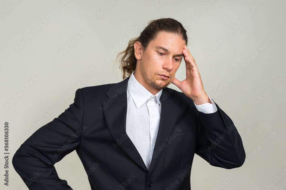 Portrait of handsome bearded businessman with long hair Portrait of handsome bearded businessman with long hair