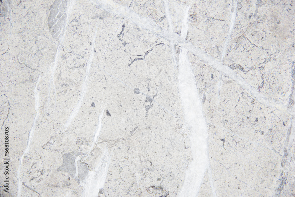 Light natural stone with streaks. Marble texture. Gentle warm cream. Stone background