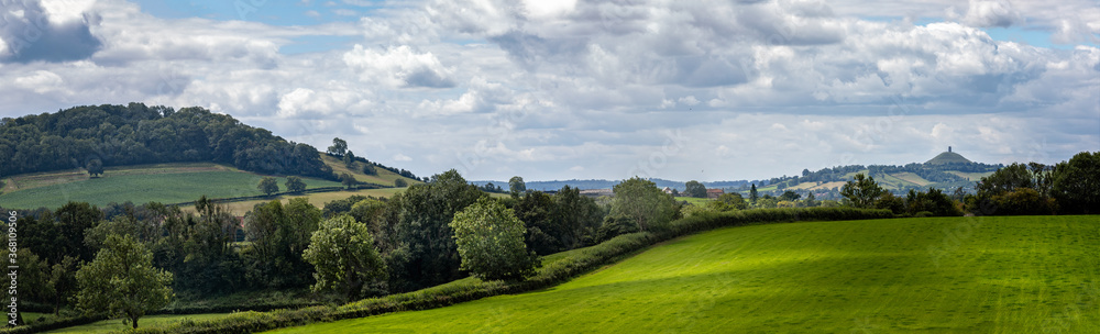 Panoramic landscape view of Somerset countryside with historic Glastonbury Tor