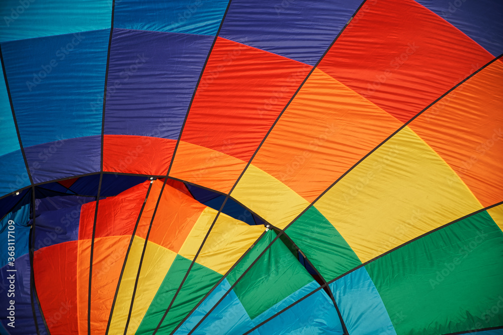 Fototapeta premium Element of the outer surface of a multicolor balloon. Rainbow colors and pride flag. Diversity and freedom