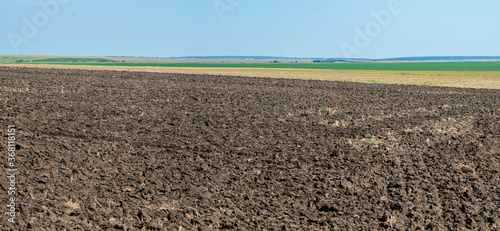 Beautiful soil land field. Agricultural rural landscape, colorful hills.