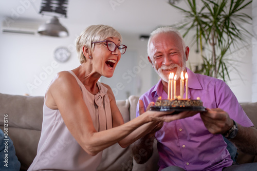 Sticker Senior couple celebrating at home.