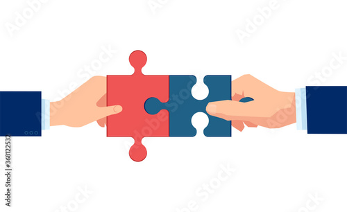 Vector of two hands putting puzzle pieces together