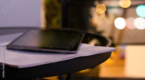 An open book and tablet on ...
