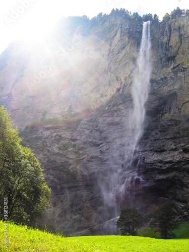 Staubbach waterfall in Interlaken, Switzerland on cliff during summer with sunlight