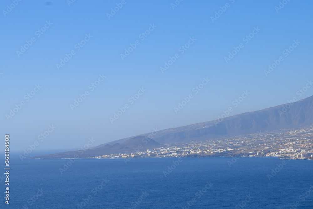 Landscape from Santa Cruz de Tenerife, Canary Islands, Spain. Coast of the islands, and towns over the seashore Landscape from Santa Cruz de Tenerife, Canary Islands, Spain. Coast of the islands, and towns over the seashore