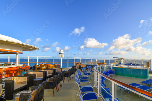 Картината върху платно An empty bar lounge on the upper deck of a cruise ship at sea.