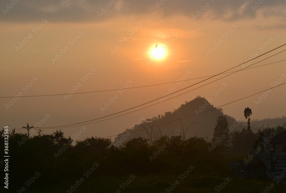 sunsrise over Petarangan mountains in Tlahab, central java, indonesia