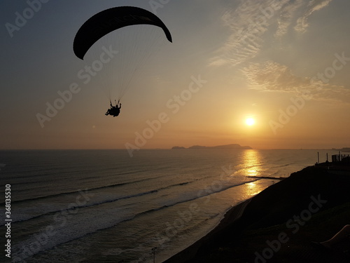 Paragliding on sunset at Miraflores, Lima, Peru