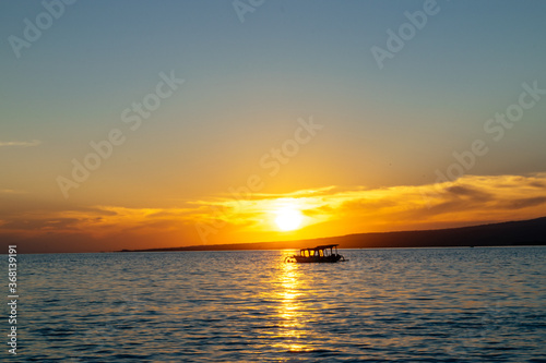 A boat in the tropical sunset at low tide Gili Trawangan Island, Lombok, Indonesia