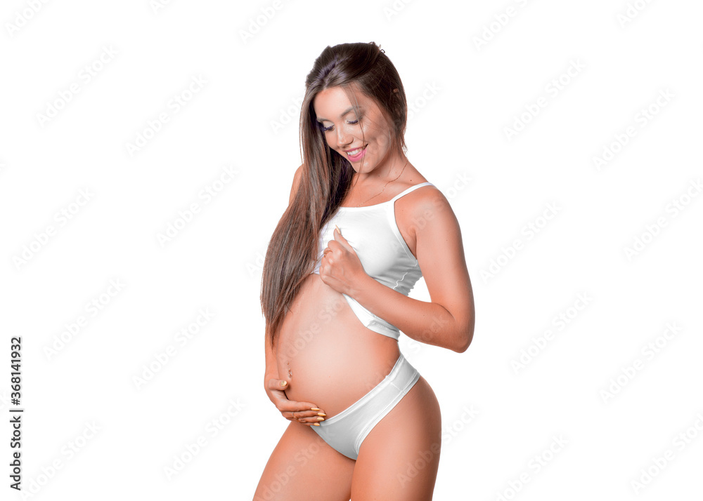 Smiling pregnant woman holding her tummy. Smiling pregnant woman holding her tummy.