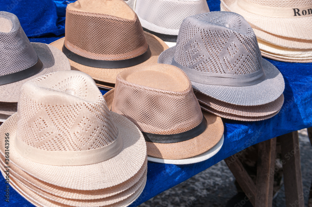 China, Heihe, July 2019: sale of men's hats at the market in Heihe in the summer