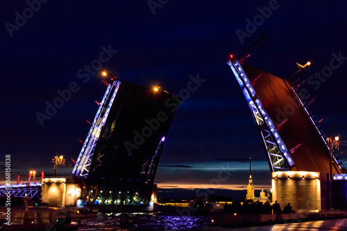 Opening of Palace drawbridge. Night view of Palace bridge from the Neva river in Saint Petersburg, Russia