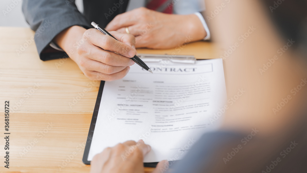 Business people meeting with signed contract. Business people meeting with signed contract.