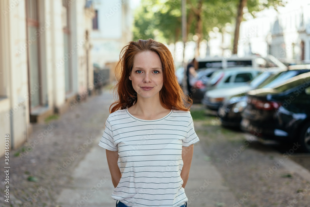 Young woman with a quiet attentive smile