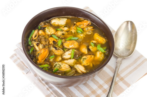 Hot spicy soup with mussels and vegetables