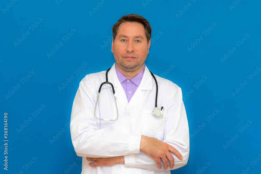 Photo of brunet hair bristle doc assistant folded hands over chest stand isolated on light blue background Photo of brunet hair bristle doc assistant folded hands over chest stand isolated on light blue background