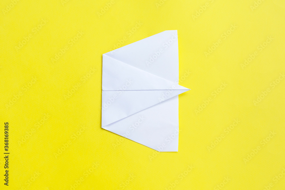 assembly procedure of a paper white airplane. Origami. C assembly procedure of a paper white airplane. Origami. C