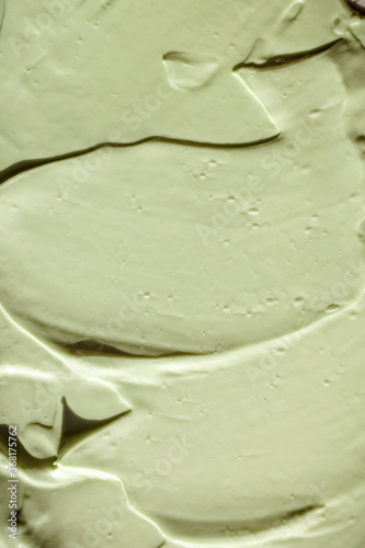 Green cosmetic clay texture close-up