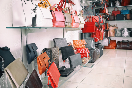 Stylish bags in modern shop
