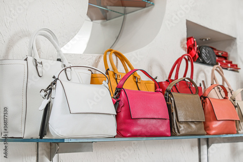 Stylish bags in modern shop