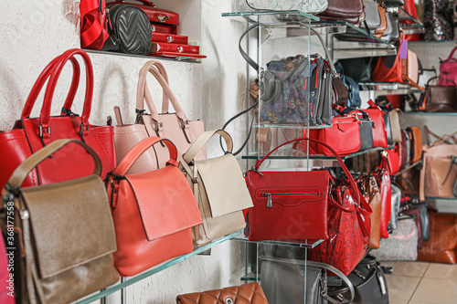 Stylish bags in modern shop