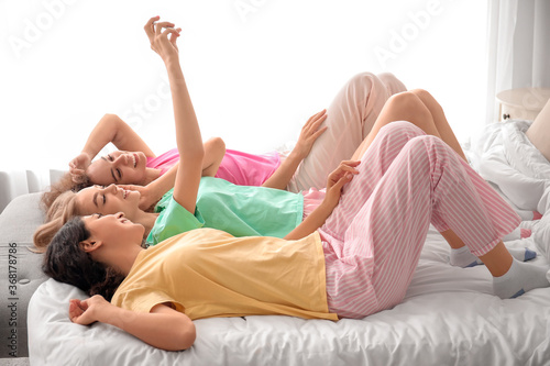 Beautiful young women takin...