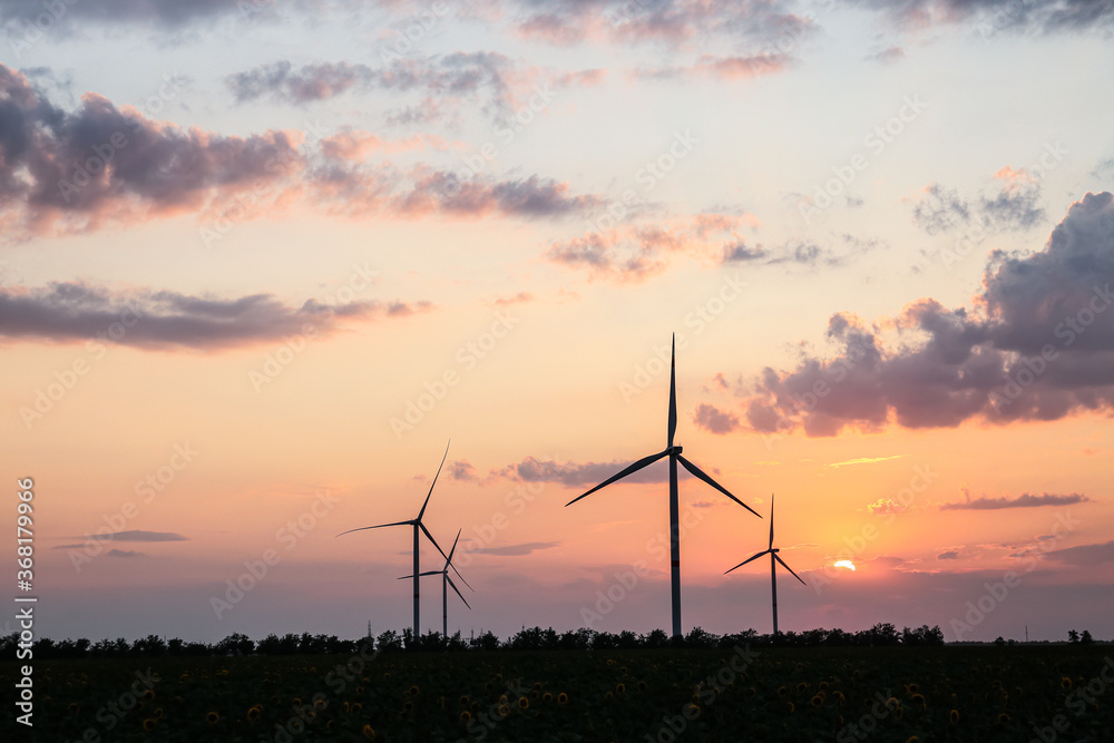 Windmills for electric power in countryside Windmills for electric power in countryside